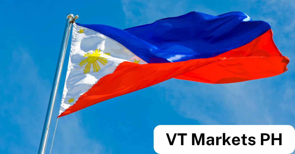 Philippine flag waving against a clear blue sky, representing VT Markets Philippines and the growing opportunities for Forex trading in the country.