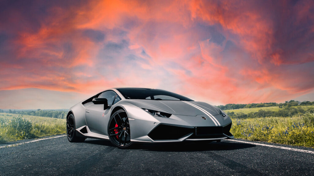 A Lamborghini set against a red sky.