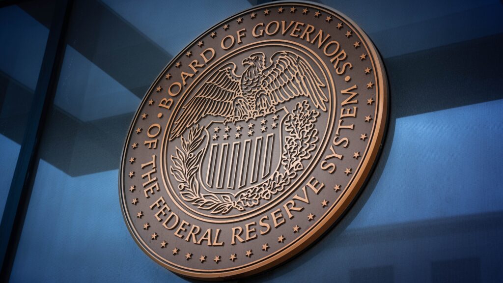 Seal of the Board of Governors of the Federal Reserve System displayed on a building, representing financial governance and stability
