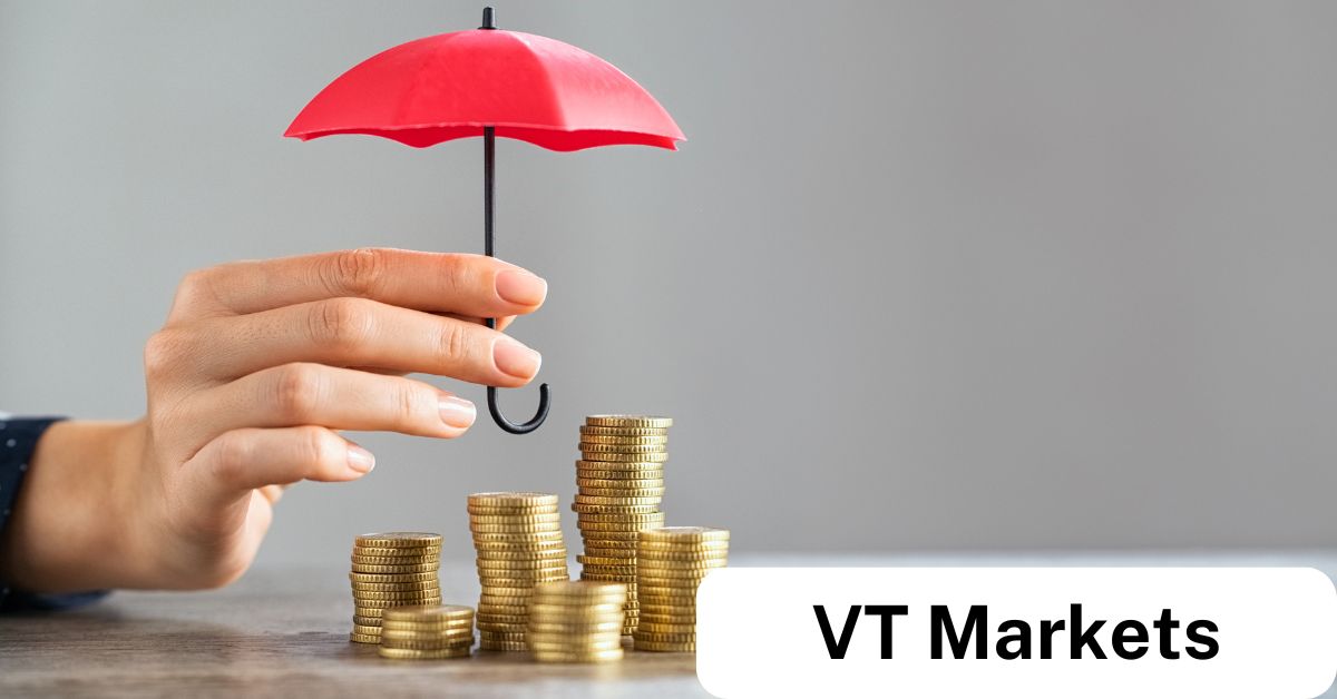 Close-up of a hand holding a red umbrella over stacks of gold coins, symbolising financial protection and security offered by VT Markets’ Negative Balance Protection.